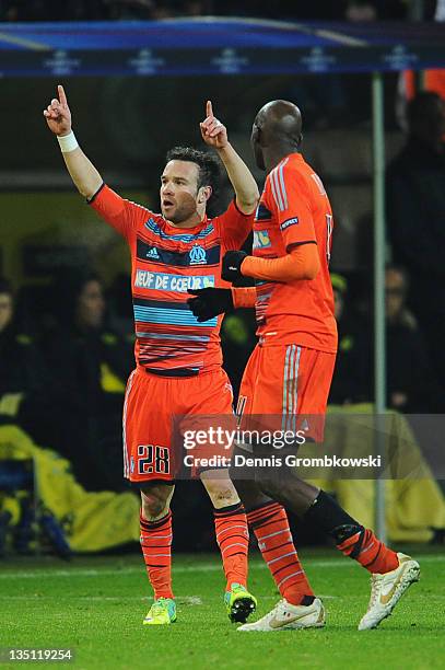 Mathieu Valbuena of Marseille celebrates with team mates after scoring his team's third goal during the UEFA Champions League group F match between...