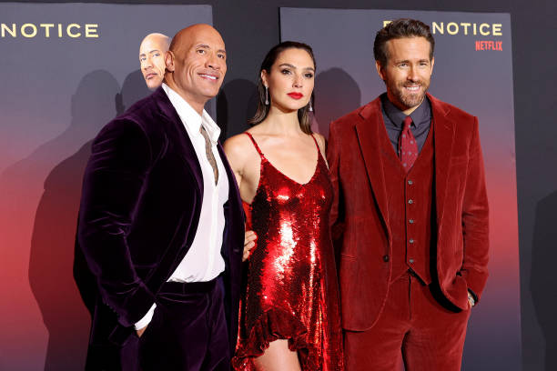 Dwayne Johnson, Gal Gadot and Ryan Reynolds attend the World Premiere Of Netflix's "Red Notice" at L.A. LIVE on November 03, 2021 in Los Angeles,...