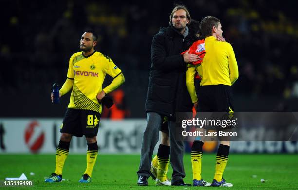 Head coach Juergen Klopp and his players are looking dejected after loosing during the UEFA Champions League group F match between Borussia Dormtund...