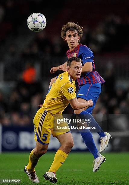 Marc Muniesa of FC Barcelona duels for a high ball with Aleksandr Yurevich of FC BATE Borisov during the UEFA Champions League group H match between...
