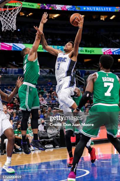 Chuma Okeke of the Orlando Magic drives to the basket against Al Horford of the Boston Celtics at the Amway Center on November 2, 2021 in Orlando,...