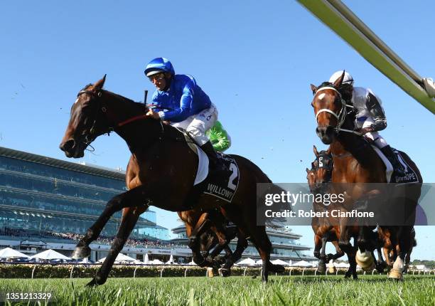 Damien Oliver riding Willowy makes his way past the post at the start of race 8, the Kennedy Oaks during 2021 Oaks Day at Flemington Racecourse on...