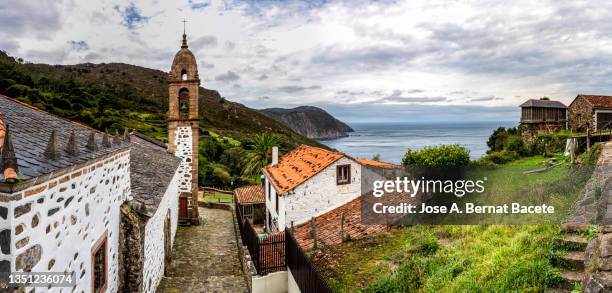 bell tower of the church of a small village by the sea on the coast of galicia - spain landscape stock pictures, royalty-free photos & images