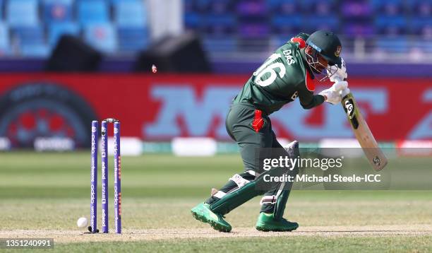 Liton Das of Bangladesh is bowled by Mitchell Starc of Australia during the ICC Men's T20 World Cup match between Australia and Bangladesh at Dubai...