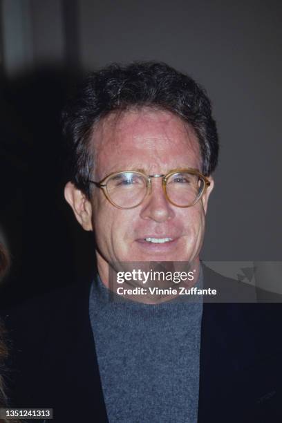 American actor Warren Beatty, wearing a grey crew neck sweater beneath a black blazer, attends the 20th Annual Los Angeles Film Festival Awards, held...