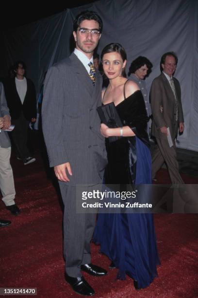 French music producer David Moreau and French actress Emmanuelle Beart, wearing a blue evening gown, attends the premiere of 'Mission Impossible',...