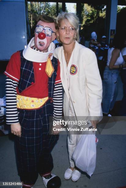American actress Meredith Baxter poses with an clown as she attends 'The Greatest Show on Earth' performed by the Ringling Brothers and Barnum &...