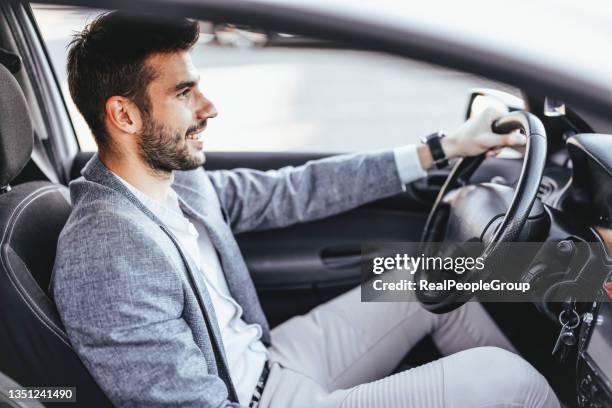 man driving his car - choosing insurance stock pictures, royalty-free photos & images