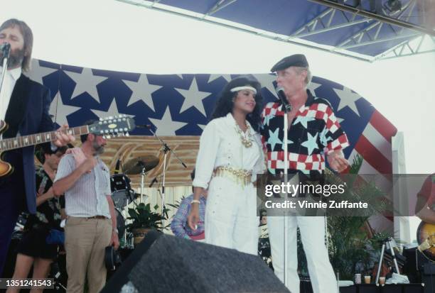 American singer-songwriter and actress La Toya Jackson and American singer and songwriter Mike Love as The Beach Boys perform at their annual Fourth...