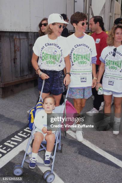 American actress and comedian Amanda Bearse with a group of women, each wearing a 'Permanent Charities Committee Earthwalk 1990' t-shirt, with Bearse...