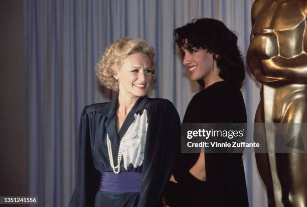 American actress Glenn Close and American actress Jennifer Beals in the press room of the 57th Academy Awards, held at the Dorothy Chandler Pavilion...