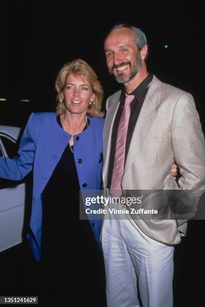 American actress Meredith Baxter wearing a blue, crew neck jacket over a black outfit, with her 'Family Ties' co-star, American actor Michael Gross,...