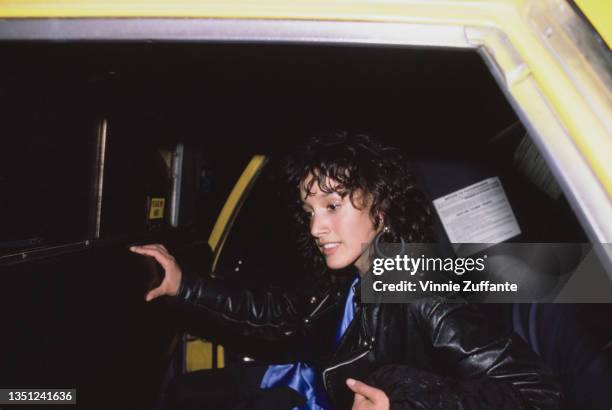 American actress Jennifer Beals emerging from a cab as she arrives for the 'Top Gun' afterparty at Cafe America in New York City, New York, 12th May...