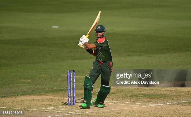 Soumya Sarkar of Bangladesh plays a shot during the ICC Men's T20 World Cup match between Australia and Bangladesh at Dubai International Stadium on...