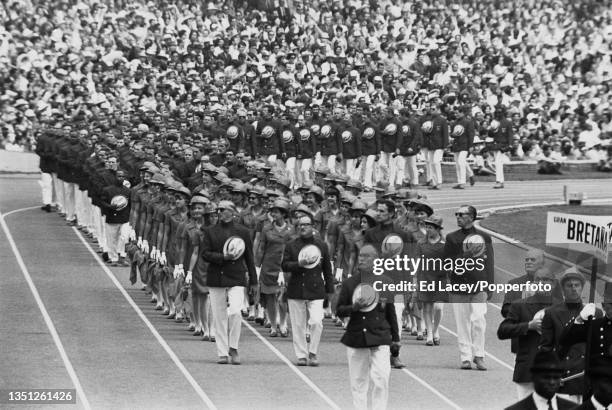 The Great Britain Olympic team, led by their flag-bearer, long jumper Lynn Davies, enter the stadium during the 1968 Summer Olympics opening ceremony...