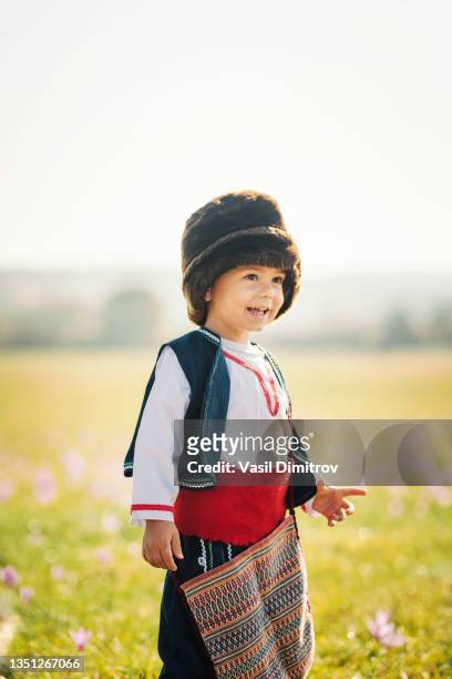 cute little boy in traditional bulgarian costume. - bulgarians stock pictures, royalty-free photos & images