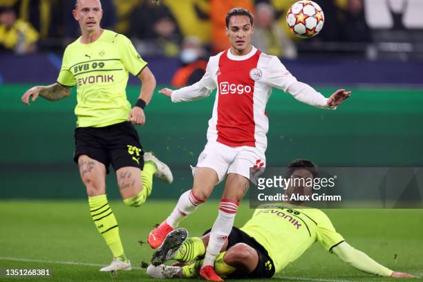 Antony of Ajax is challenged by Mats Hummels of Borussia Dortmund during the UEFA Champions League group C match between Borussia Dortmund and AFC...