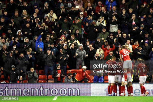 Barnsley fans celebrate their side's second goal scored by Aaron Leya Iseka of Barnsley during the Sky Bet Championship match between Barnsley and...