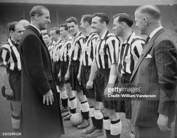 Prince Philip, Duke of Edinburgh greets players of the Newcastle United football team before their FA Cup final match against Manchester City on 7th...
