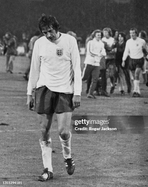 English footballer Norman Hunter walks off the pitch looking utterly dejected after England drew their vital FIFA World Cup qualifier 1-1 against...