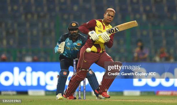 Shimron Yetmyer of West Indies plays a shot as Kusal Perera of Sri Lanka looks on during the ICC Men's T20 World Cup match between West Indies and...