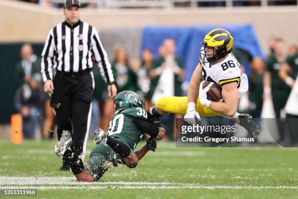 Luke Schoonmaker of the Michigan Wolverines plays against the Michigan State Spartans at Spartan Stadium on October 30, 2021 in East Lansing,...