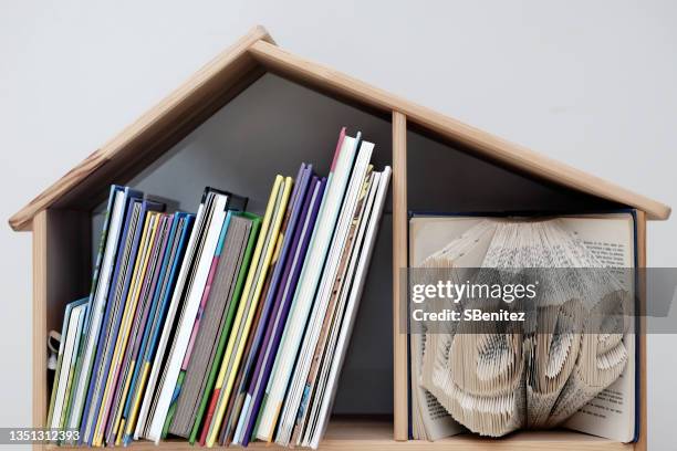bookshelf loaded with children’s books in toddler girl’s bedroom - children's literature stock pictures, royalty-free photos & images