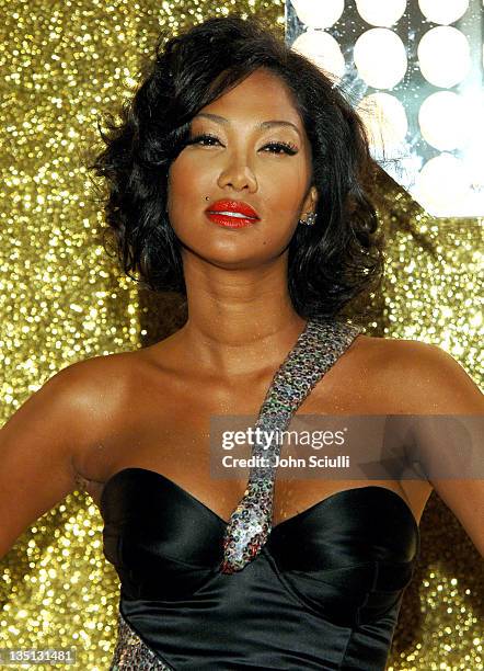 Kimora Lee Simmons wearing a dress by Scott Henshall