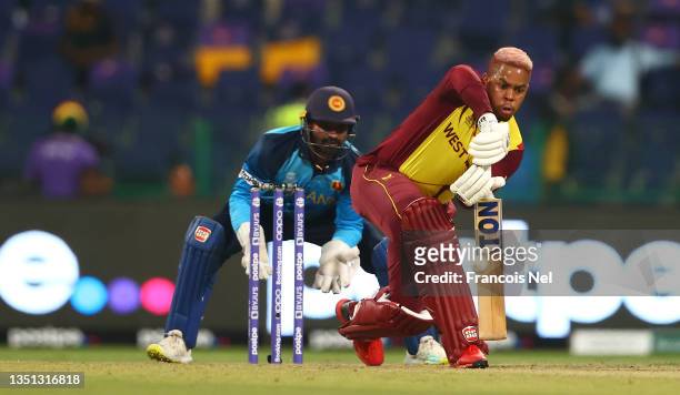Shimron Yetmyer of West Indies plays a shot as Kusal Perera of Sri Lanka looks on during the ICC Men's T20 World Cup match between West Indies and...