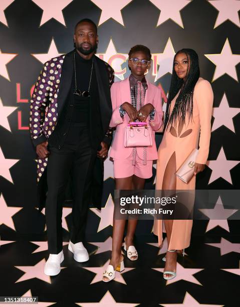 Dwyane Wade, Zaya Wade, and Gabrielle Union arrive at Gucci Love Parade on November 02, 2021 in Los Angeles, California.