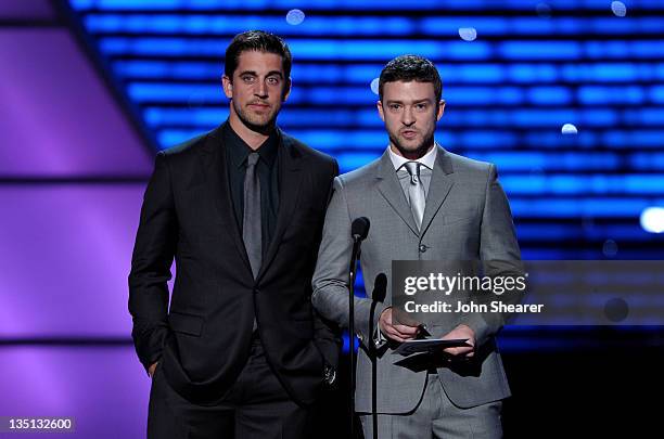 Quarterback Aaron Rodgers of the NFL's Green Bay Packers and actor/singer Justin Timberlake present the award for 'Best Male College Athlete' onstage...