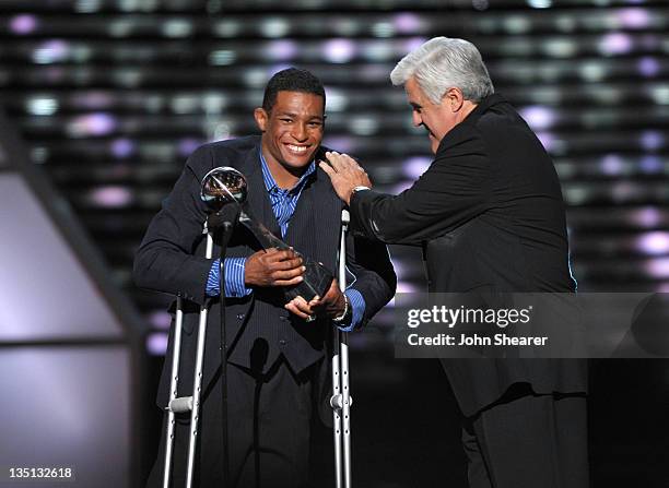 Wrestler Anthony Robles accepts the 'Jimmy V Award for Perservance' from comedian Jay Leno onstage at The 2011 ESPY Awards held at the Nokia Theatre...