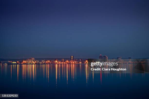 cityscape over the evening lake - new haven connecticut stock pictures, royalty-free photos & images