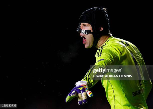 Chelsea's Czech goalkeeper Petr Cech shouts instructions to his teammates against Valencia during their UEFA Champions League group E football match...