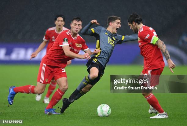 Robin Knoche of 1.FC Union Berlin battles for possession with Mark Diemers of Feyenoord during the UEFA Europa Conference League group E match...