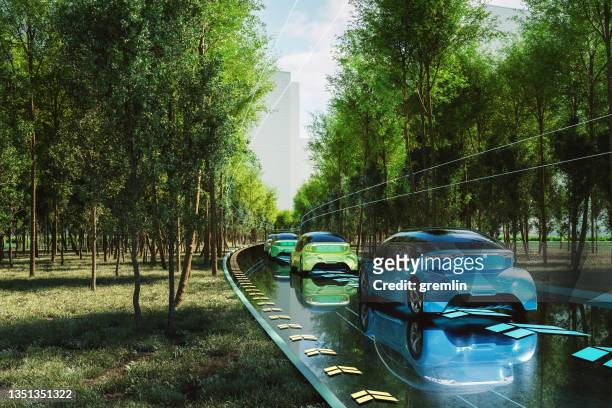 sauberer futuristischer elektroautos straßenverkehr - zukunft stock-fotos und bilder
