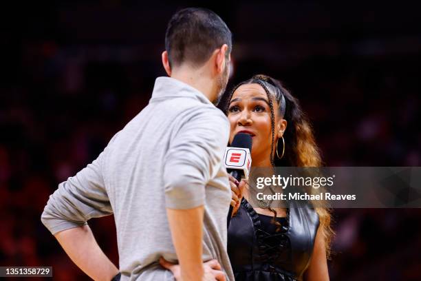 Analyst Rosalyn Gold-Onwude talks with head coach James Borrego of the Charlotte Hornets against the Miami Heat at FTX Arena on October 29, 2021 in...