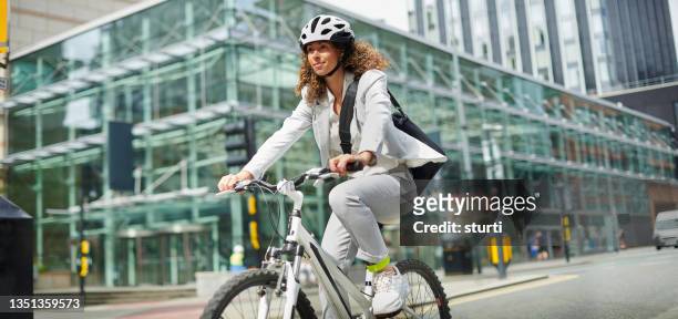 cycling commuter - sports helmet stock pictures, royalty-free photos & images