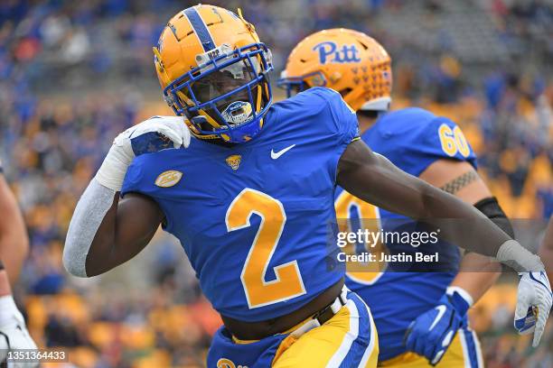 Israel Abanikanda of the Pittsburgh Panthers reacts after rushing for a 1-yard touchdown in the first quarter during the game against the Miami...