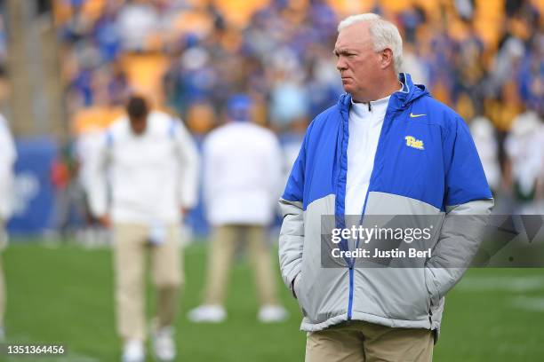 Offensive Coordinator Mark Whipple of the Pittsburgh Panthers looks on during warmups before the game against the Miami Hurricanes at Heinz Field on...