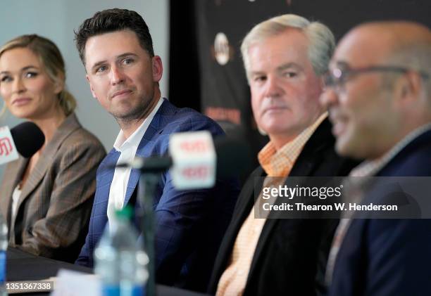 Kristen Posey, Buster Posey, Greg Johnson and President of baseball operations Farhan Zaidi for the San Francisco Giants at a press conference...