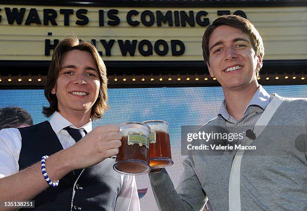 Actors James Phelps and Oliver Phelps attend Universal Studios Hollywood Hosts Butterbeer Toast! at The Globe Theatre on December 6, 2011 in...