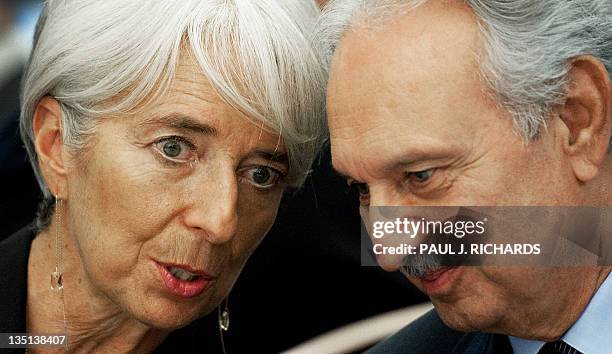 Managing Director Christine Lagarde confers with Lebanese Finance Minister Mohammad Safadi following Legarde's speech on development and governance...