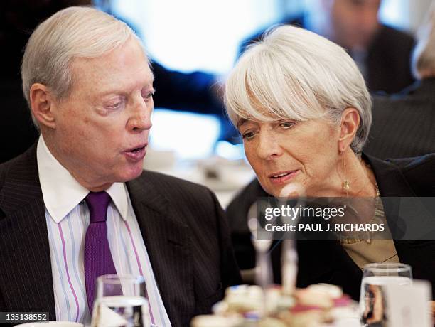 Managing Director Christine Lagarde confers with Joseph B. Gildenhorn , Chairman of the Wilson Center Board of Trustees, following Legarde's speech...