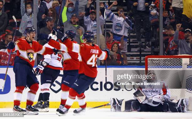 Eetu Luostarinen of the Florida Panthers scores in overtime to defeat Vitek Vanecek and the Washington Capitals on November 04, 2021 at the FLA Live...