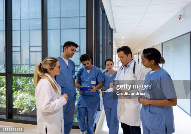 group of doctors in a meeting at the hospital - civil imagens e fotografias de stock