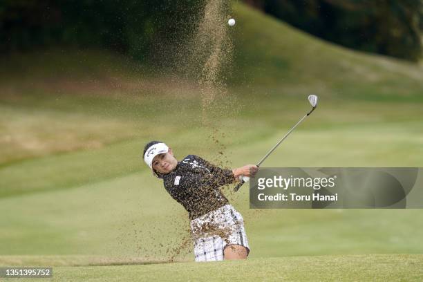 Yui Kawamoto of Japan hits out from a bunker on the 5th hole during the second round of TOTO Japan Classic at the Seta Golf Course on November 5,...