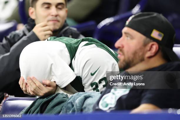 New York Jets fan rests his head in his hands during the second half at Lucas Oil Stadium against the Indianapolis Colts on November 04, 2021 in...