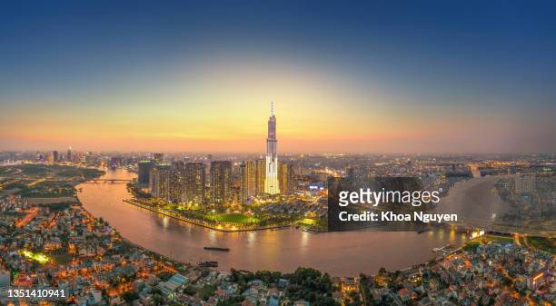 aerial view of ho chi minh city, vietnam, beauty skyscrapers along river light smooth down urban development - vietnam stockfoto's en -beelden