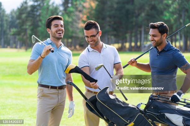 friends playing golf on a beautiful sunny day - golf tournament stock pictures, royalty-free photos & images